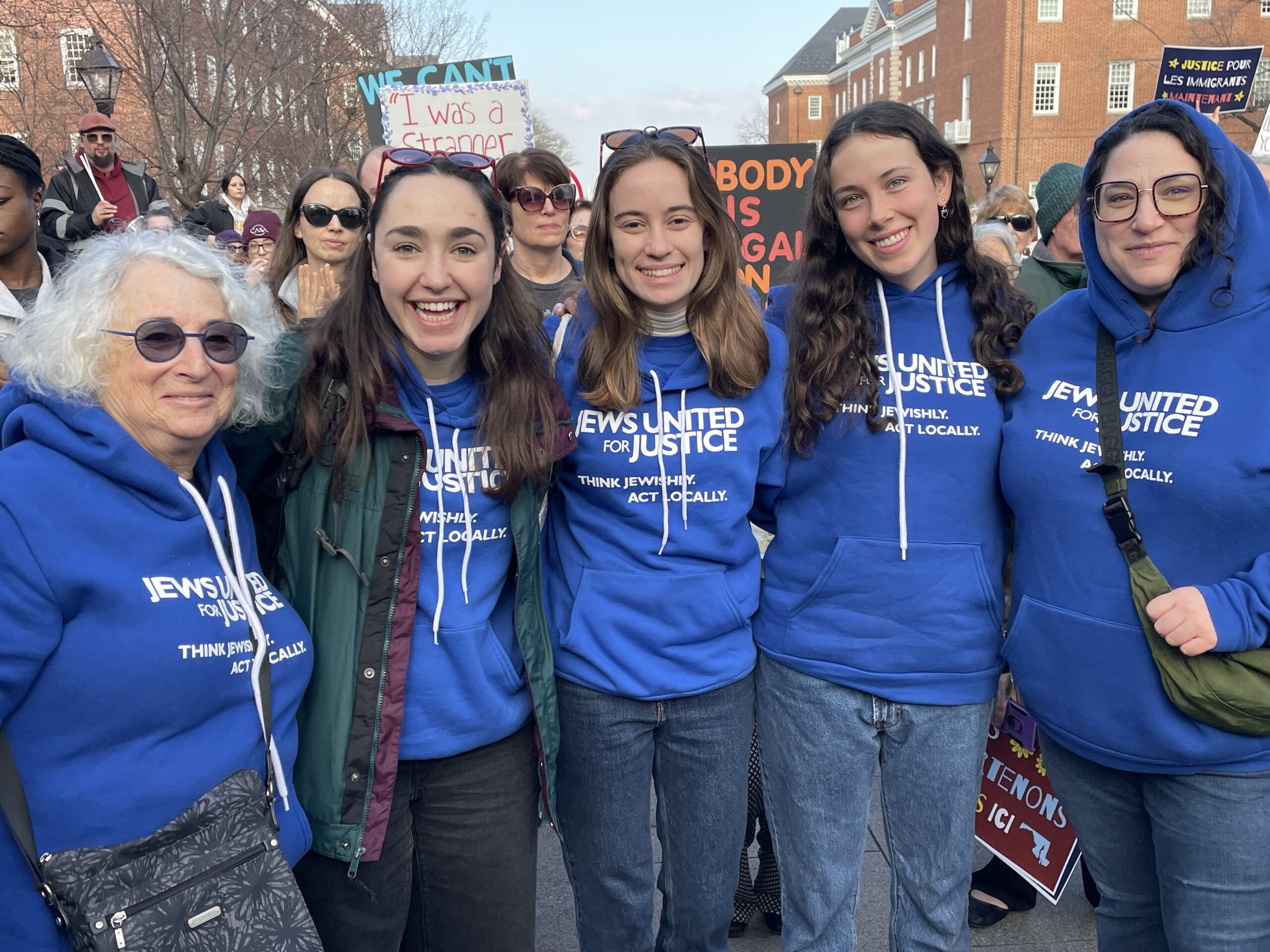 img_3843 JUFJ staff and leaders supporting justice at an immigrant justice rally -- and all wearing the same JUFJ sweatshirt!